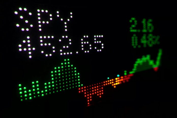 a stock chart listing on a digital board