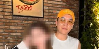 Seungri standing behind a female influencer in a social media post shared on Instagram.