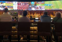 A group of people watching sports.